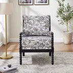 Sillón auxiliar tapizado Spool con estructura de madera torneada