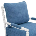 Sillón auxiliar tapizado Spool con estructura de madera torneada