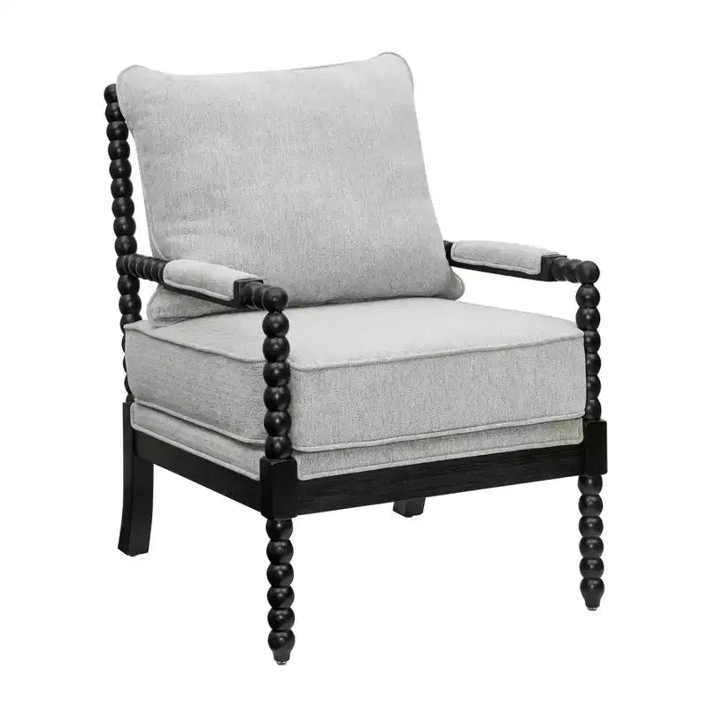 Sillón auxiliar tapizado Spool con estructura de madera torneada